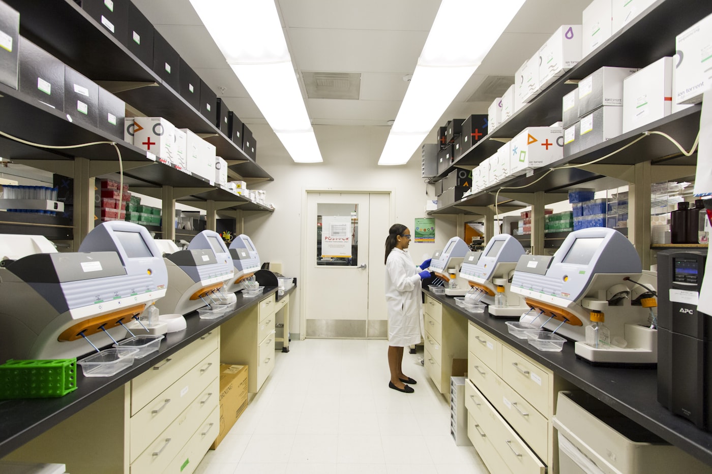 A life-sciences research laboratory with equipment and a technician